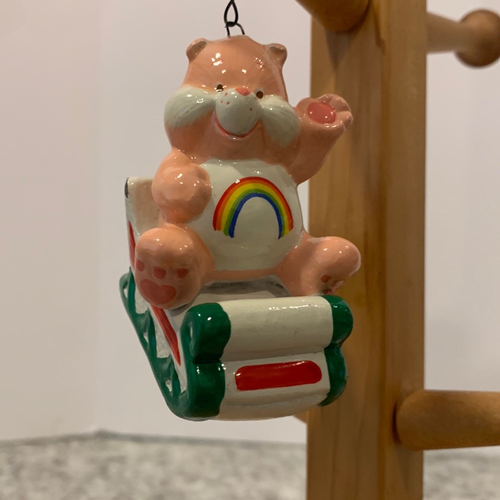 Christmas tree ornament Carebear rainbow on a sled